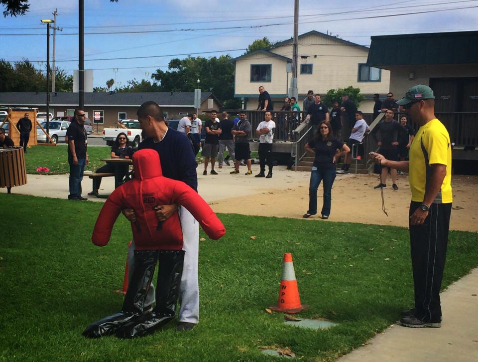 Citizens participating in an activity with a dummy